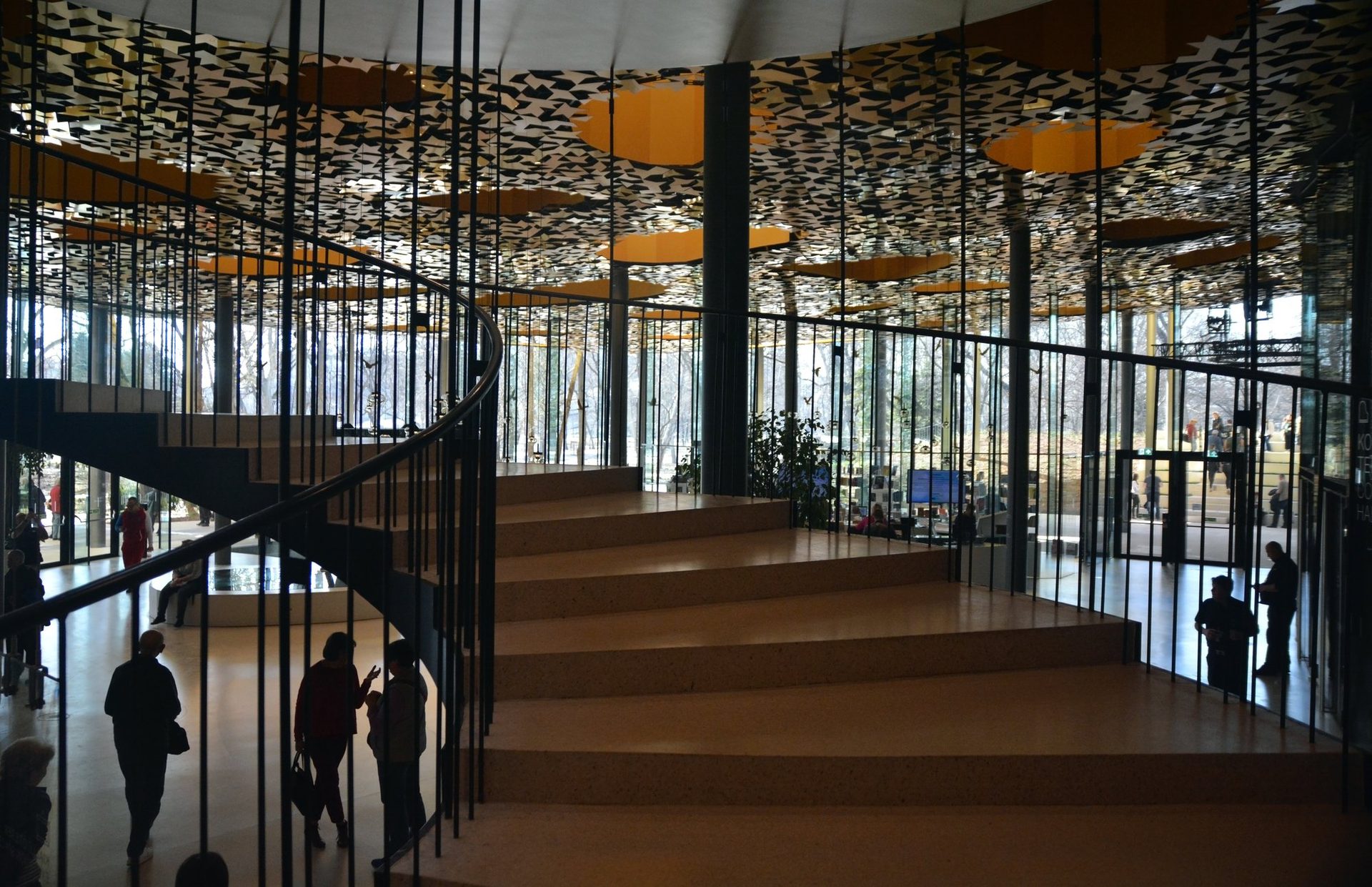 Interior atrium of House of Music Hungary, with its spiral staircase and perforated ceiling